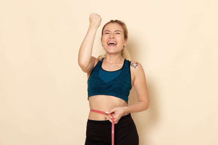 front-view-young-female-sport-outfit-measuring-her-sizes-waist Weight Loss Program