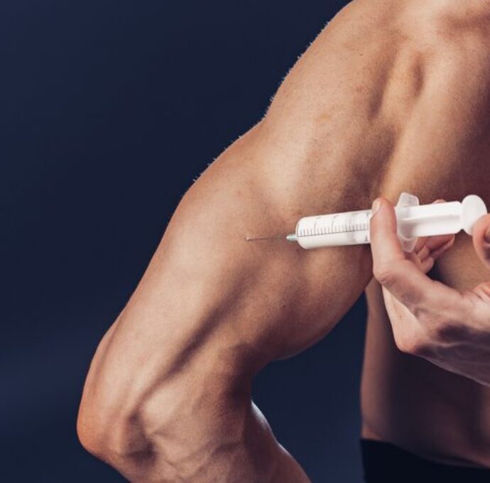 bodybuilder-makes-injection-vitamins-photo-sporty-man-with-perfect-physique-dark-background-strength-motivation_136403-8184